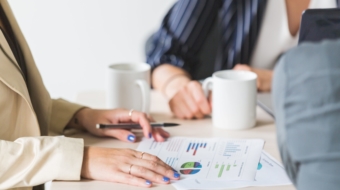 reading-charts-at-business-meeting