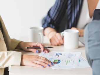 reading-charts-at-business-meeting