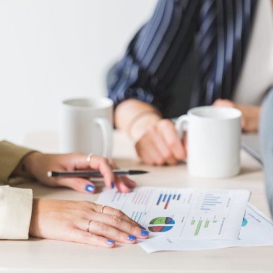 reading-charts-at-business-meeting